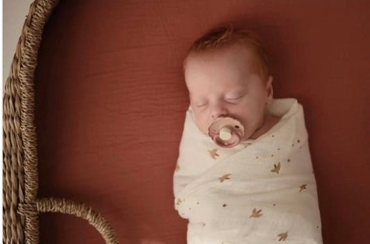 swaddled baby sleeping