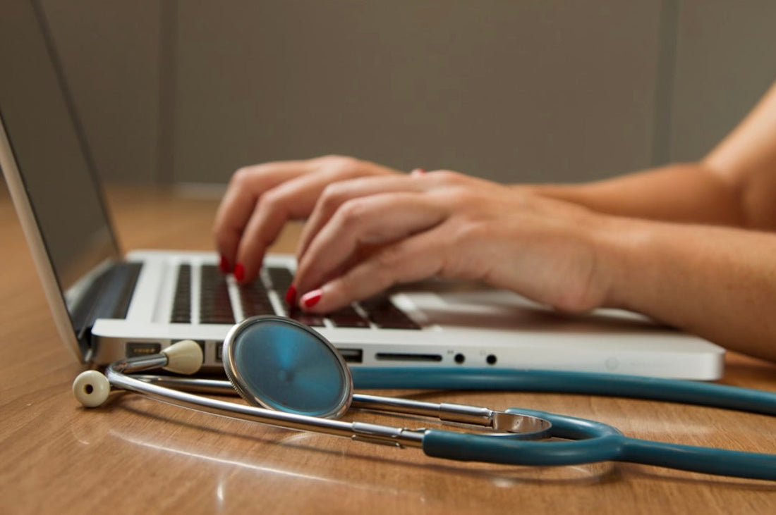 medical person on computer