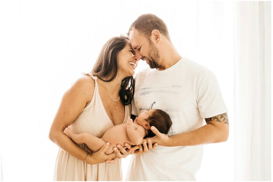 happy mom dad and baby