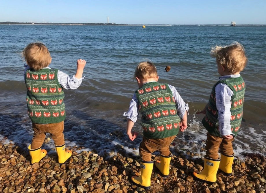 toddlers playing on beach
