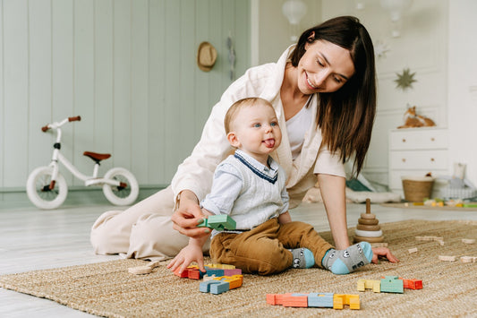 parent and child on play mat