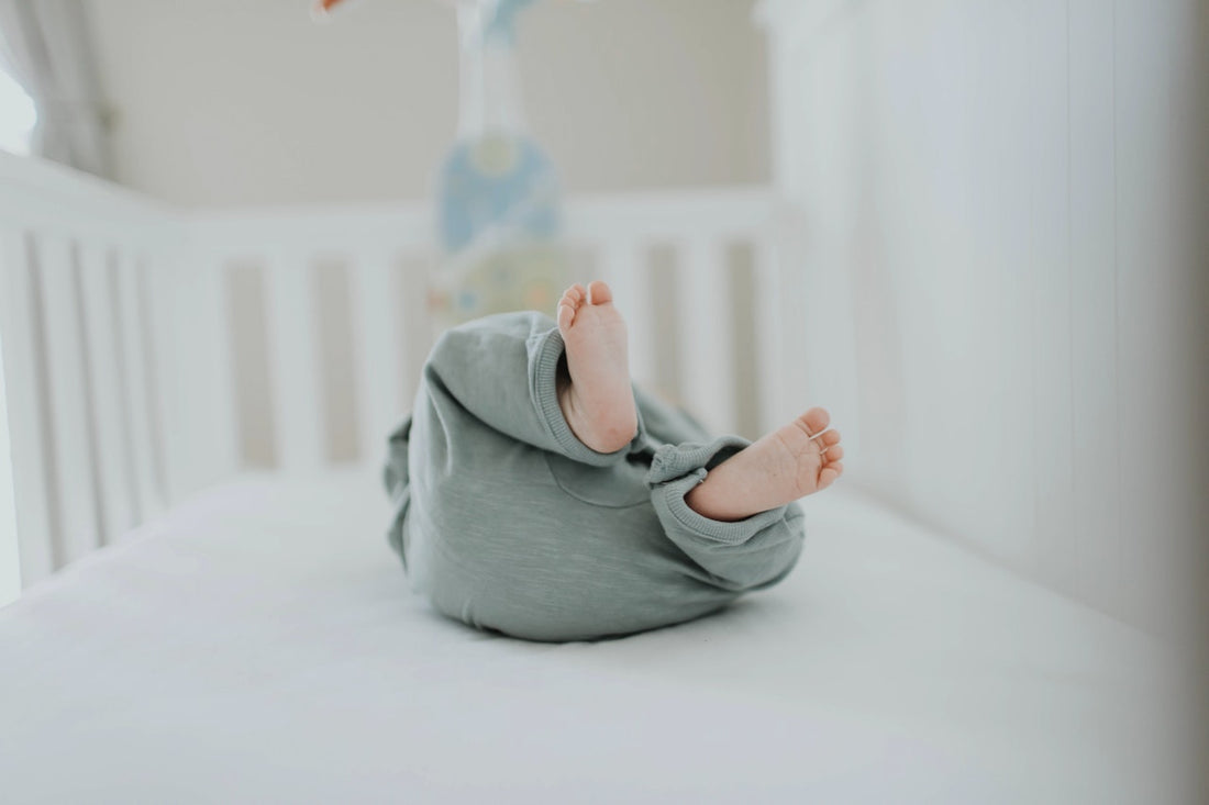 baby lying in crib